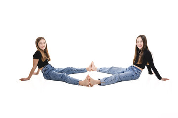 Two Young pre teen best friend girl on studio white