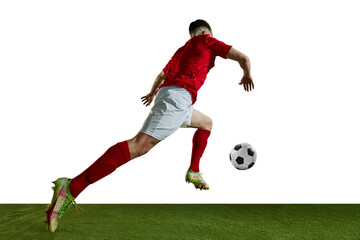 Bottom view dynamic image of young man in red uniform, football player in motion running with ball...