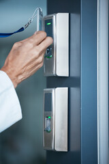 Hand, key card and scan on security door for entrance, access control and safety in business,...
