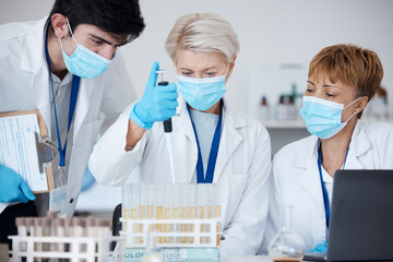 Analysis, covid team and employees in a lab for healthcare research, medical analytics or science. Chemistry, education and scientists witth face mask and teamwork to study a liquid or chemical