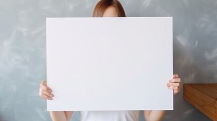 Unrecognizable people holding a simple white blank board with copy space