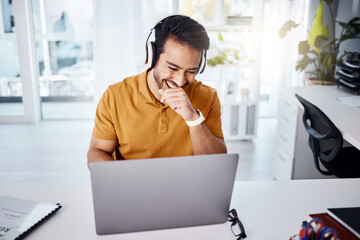 Laughing, work and a businessman with headphones and a laptop for a funny video or podcast or a meme. Happy, office and an Asian businessman with comedy, streaming audio or watching on a computer