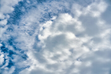 White cloudy forming on blue sky in sunny day