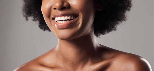 Closeup, teeth and woman with skincare, dental care and smile against a grey studio background....