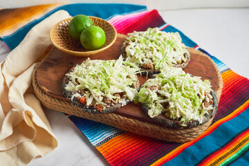 Traditional mexican blue sopes with cheese and beans