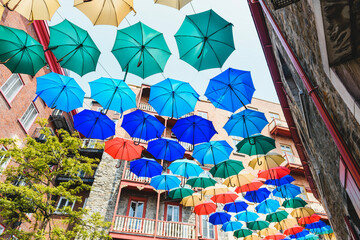Fototapeta premium Lot of Umbrellas in Petit Champlain street Quebec city