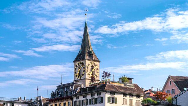 Zoom in time lapse of the bell tower of the church Saint Peter in Zurich with the largest church clock of Europe