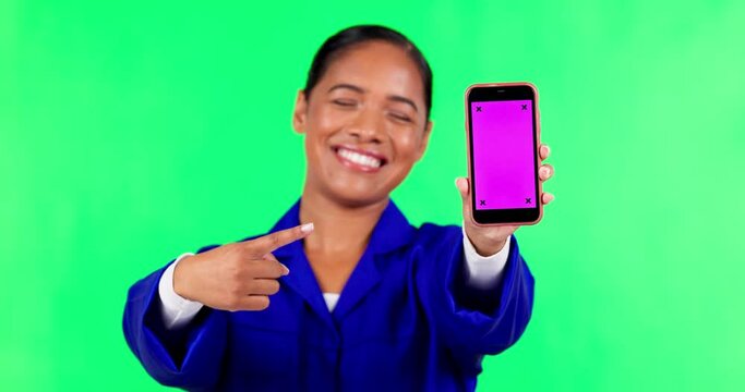 Phone, pointing and construction woman on green screen for website, internet and mobile app. Advertising, tracking markers and portrait of female mechanic on smartphone for news and social media