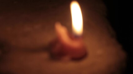 Close-up shot of candles on each step burning in a dark environment, HD video. Concept of connecting with nature, cozy home, spa treatment, Halloween concept, and Christmas Xmas BG.