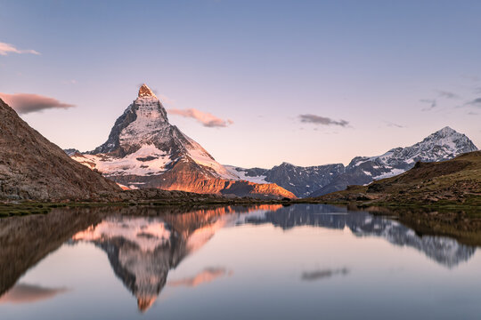Matterhorn with it's relfection in a lake during a sunrise