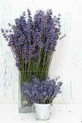 Fresh flowers of lavender bouquet on a white wooden background
