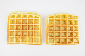 Square Belgian waffles on a white background.