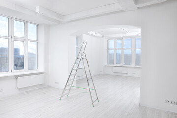 Light spacious room with step ladder. Ceiling painting