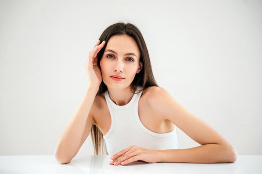 Beauty Model Posing At Studio, Looking At Camera