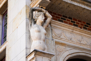 Statue of a naked lady on a cornice of the Hôtel Groslot, a 16th century mansion located in the city center of Orléans in the department of Loiret, Centre-Val de Loire, France