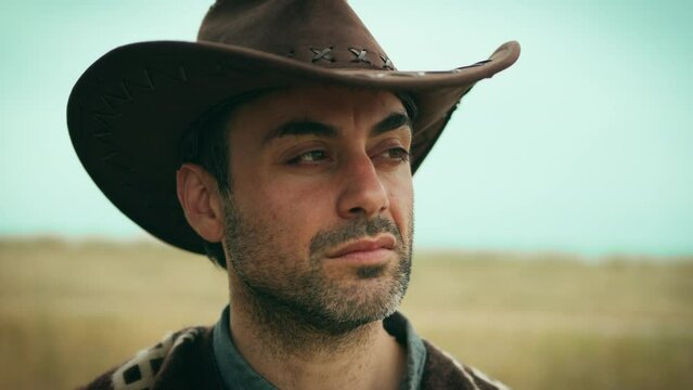 Cowboy with defiant look. Close up 