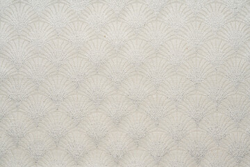 White fabric texture with an abstract pattern.