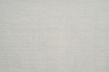 White fabric texture with an abstract pattern.