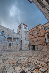 Fototapeta na wymiar The entrance to the Church of the Holy Sepulchre during a stormy day with no people