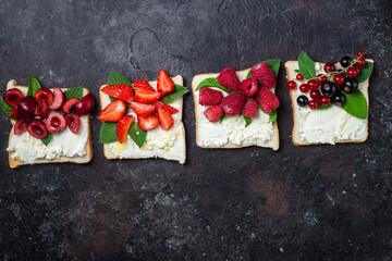 Sandwiches with cream cheese, honey and berries. Dessert