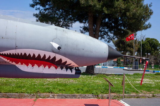 Istanbul, Yesilkoy - Turkey - 04.20.2023: F-4 Phantom Fighter Jet Plane, Supersonic jet Fighter and Bomber. Phantom Angry Face Painting, predatory look with teeth