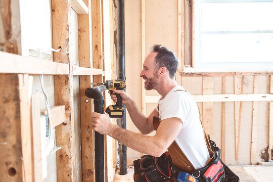 hands plumber at work in old house, plumbing repair service.