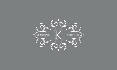 An elegant floral monogram design template for one or two letters, for example K. Wedding monogram. Vector illustration of the logo.