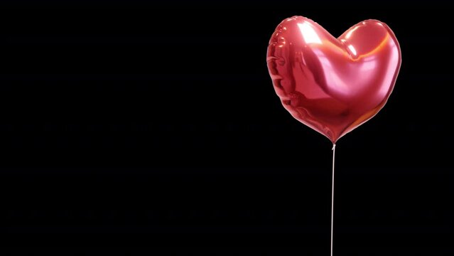 A shiny red mylar heart balloon gently bobbing up and down on a transparent alpha channel in a seamless loop.