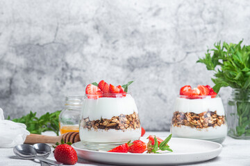 Granola with yogurt and strawberries in a glass