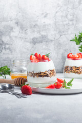 Granola with yogurt and strawberries in a glass