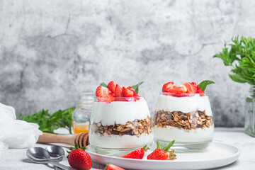 Granola with yogurt and strawberries in a glass