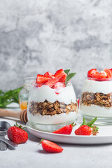 Granola with yogurt and strawberries in a glass