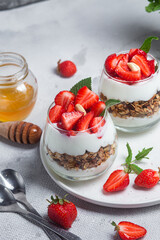 Granola with yogurt and strawberries in a glass