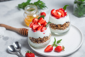 Granola with yogurt and strawberries in a glass