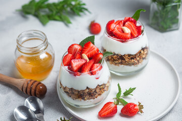 Granola with yogurt and strawberries in a glass