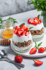 Granola with yogurt and strawberries in a glass