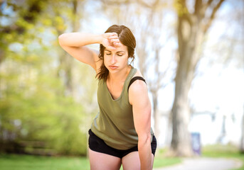 Female Runner Jogging during Outdoor Workout in a Park