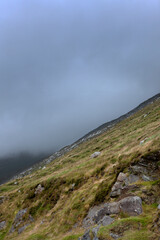 Fototapeta na wymiar Westcoast Ireland. Misty and foggy landschape. Keel. Steep hill.