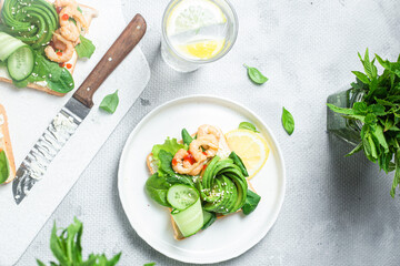 Sandwich with cream cheese, shrimp, avocado and cucumber