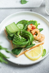Sandwich with cream cheese, shrimp, avocado and cucumber
