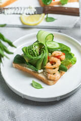 Sandwich with cream cheese, shrimp, avocado and cucumber