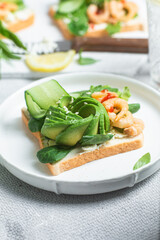 Sandwich with cream cheese, shrimp, avocado and cucumber