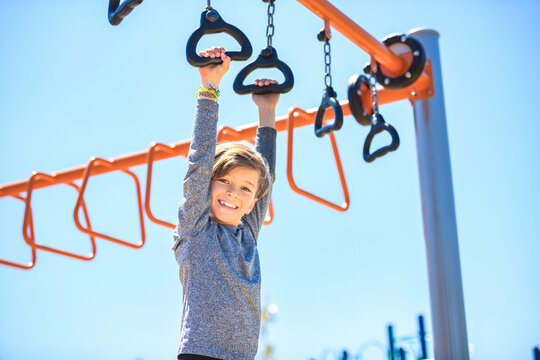 child boy on a playground on summer day.