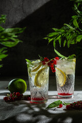 Cocktail with lemon and mint on a dark background. Lemonade