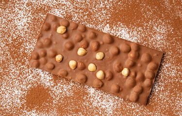 Milk chocolate and cocoa on a white background
