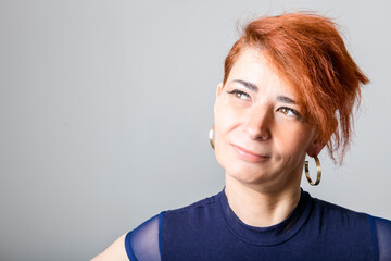 Portrait of a mature woman on studio background