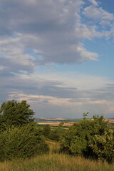 A landscape with trees and clouds