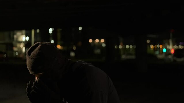 A dangerous masked criminal opens a knife in preparation for an attack. Suddenly, a jet of gas leaks into his eyes, and he covers his eyes with his hands, losing his bearings