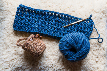 Close-up of multicolored and blue natural wool yarn balls. Home hobby.