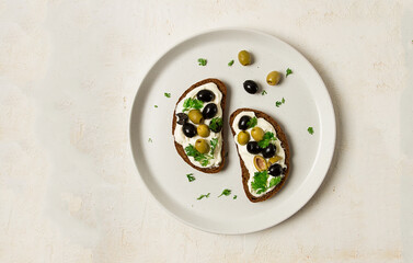 Breakfast, sandwiches, with cream cheese, olives, top view,